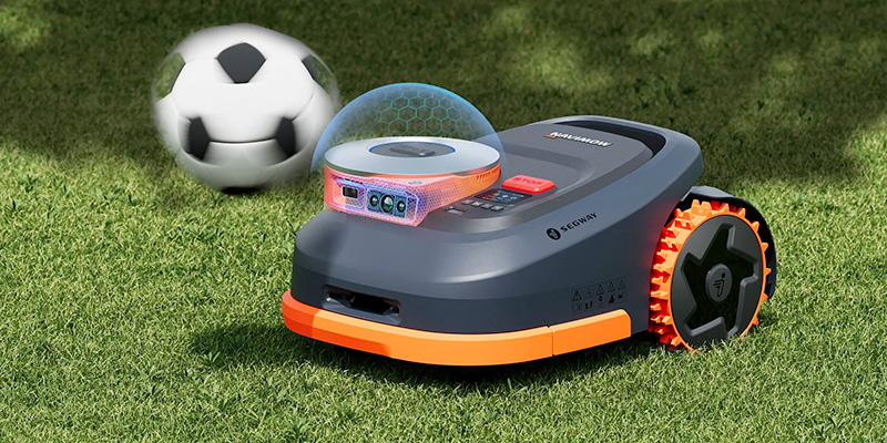 Silent 60 dB robot lawnmower in the garden